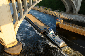 Aerial View of a Tugboat Pushing Barges on the Mississippi River Near Saint Paul